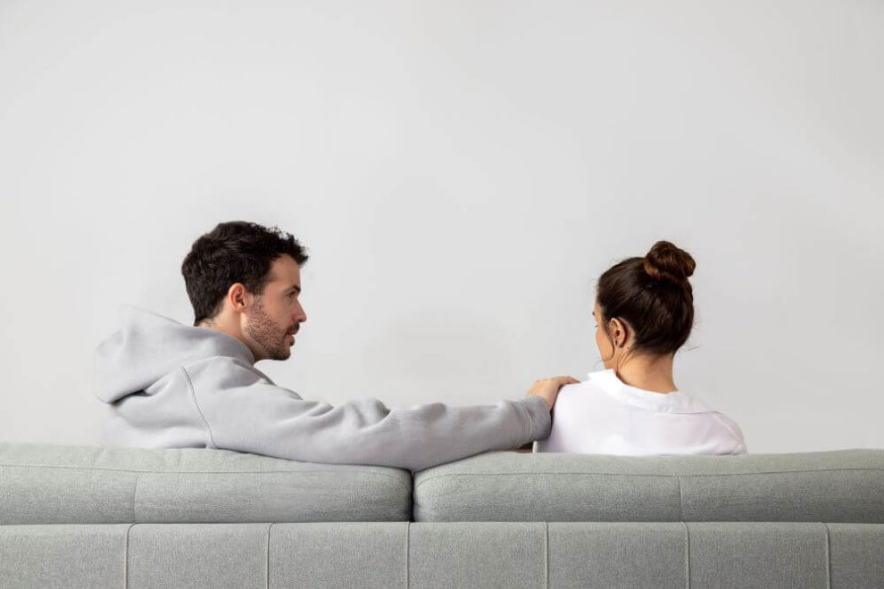 Spouse Wants a Divorce. What to do? Divorcing couple sitting on the couch