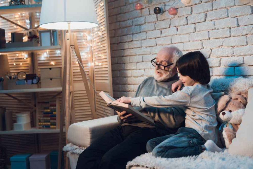 grandparents rights ontario. Grandfather reading to his grandson.